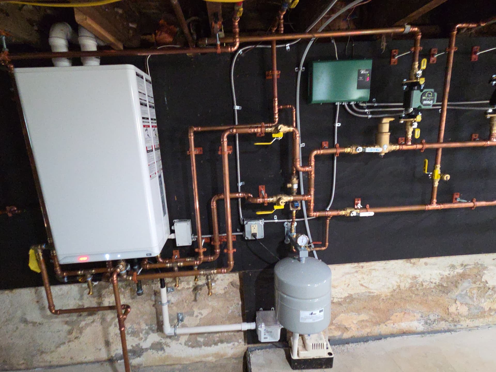High-efficiency boiler and tankless water heater installed by Aces Highlands