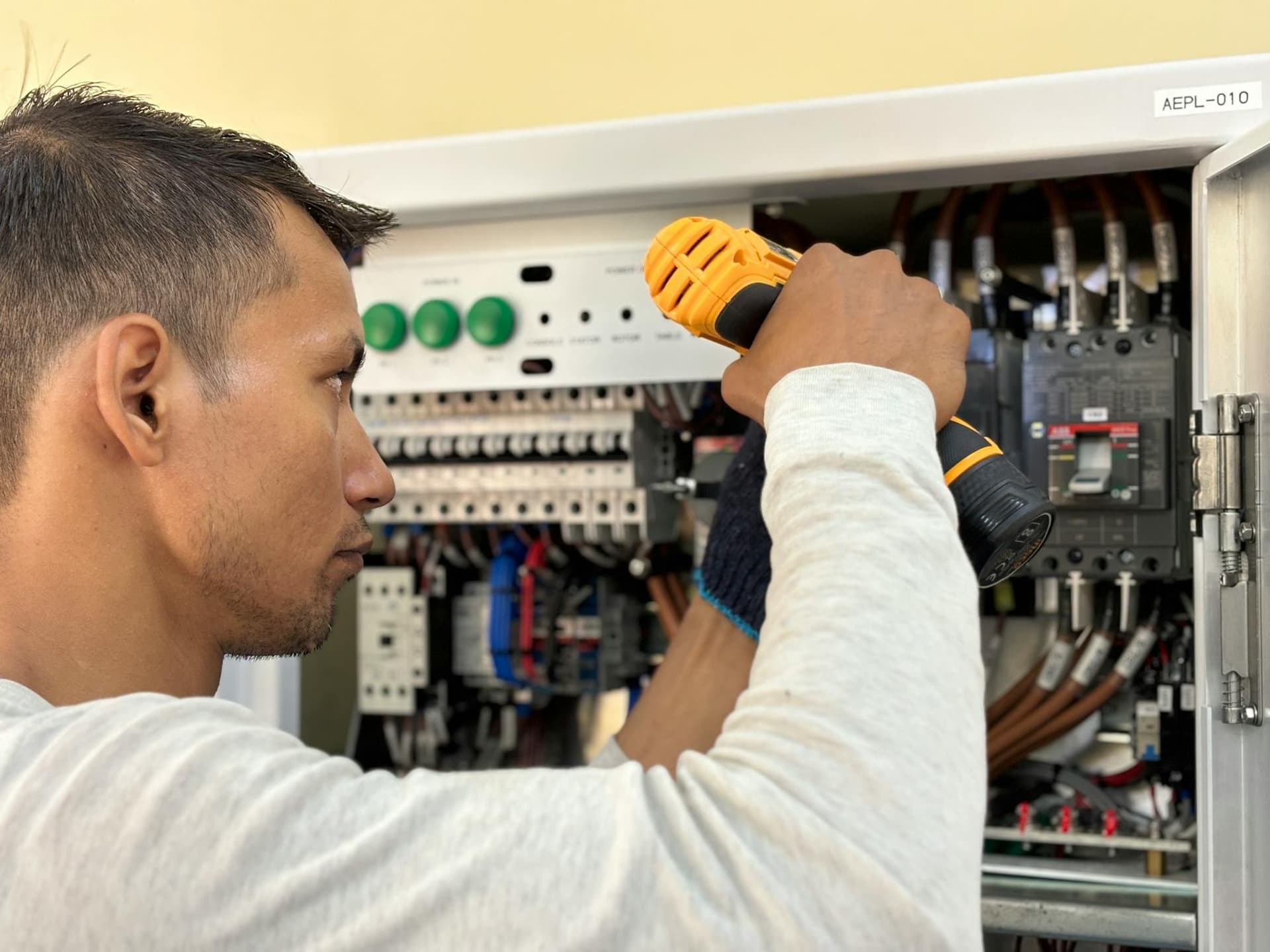 Open electrical panel showing breaker rows