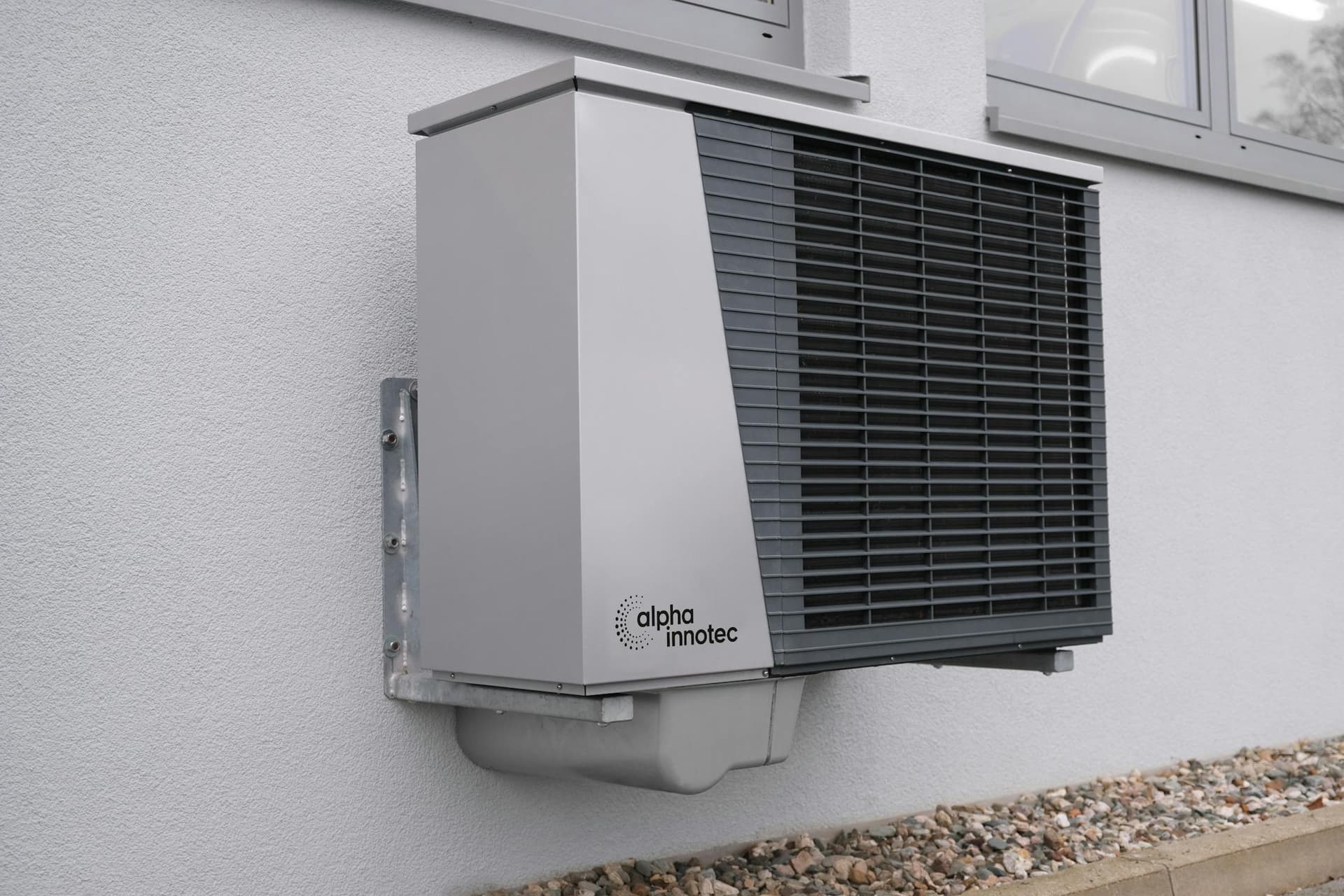 Ductless heat pump outdoor condenser unit on a concrete pad