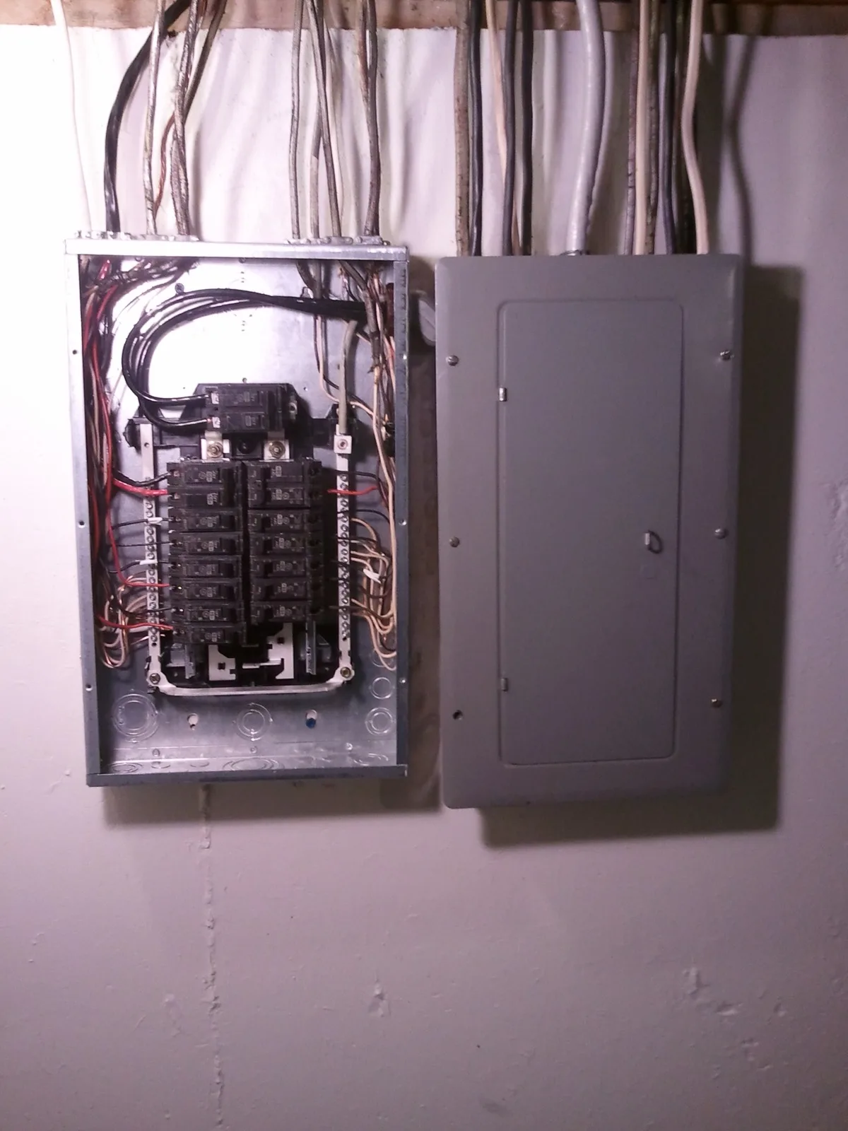 Electrical panel and subpanel with the subpanel cover removed for repair work