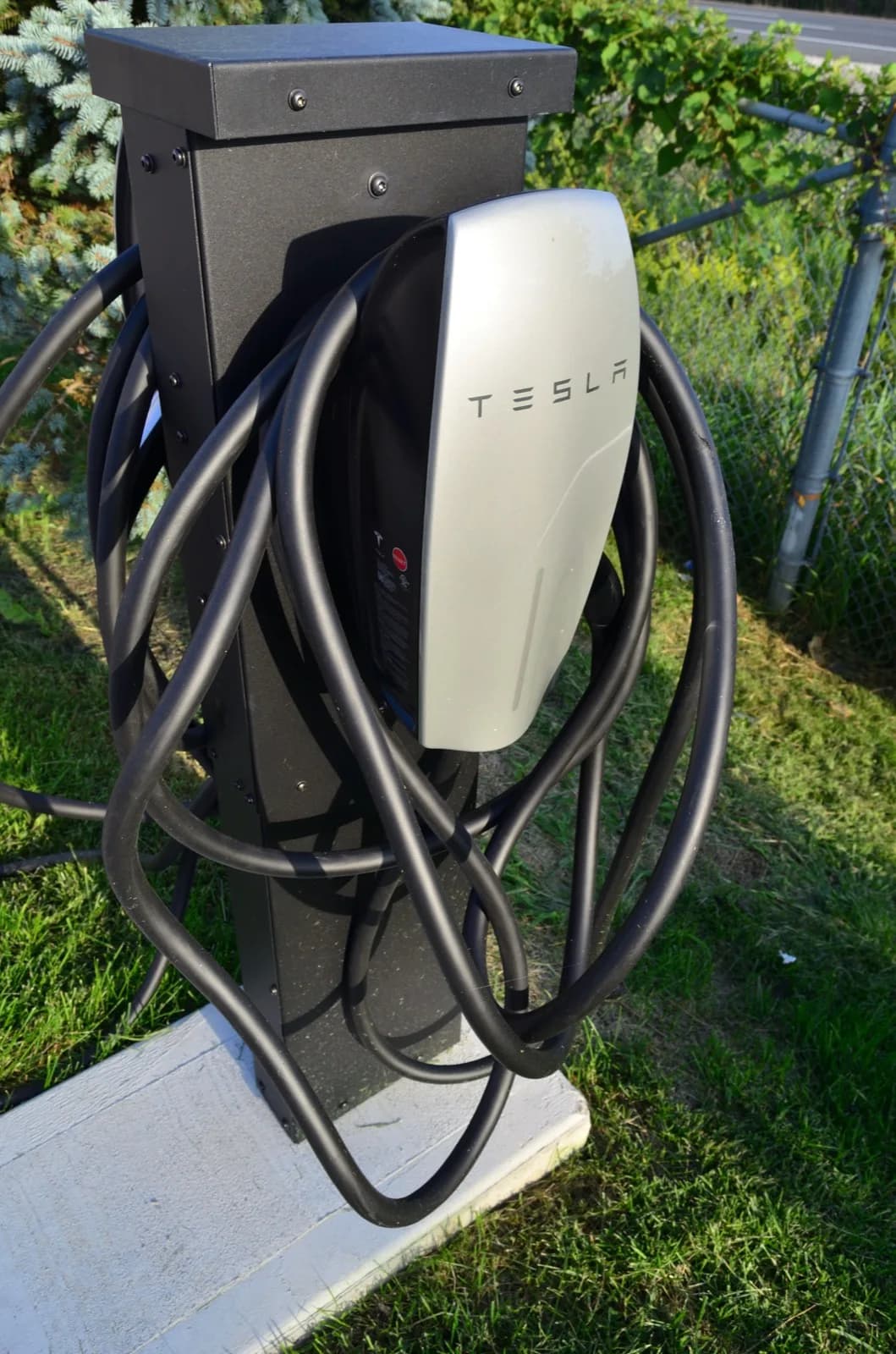 EV charging connector mounted on an outdoor post