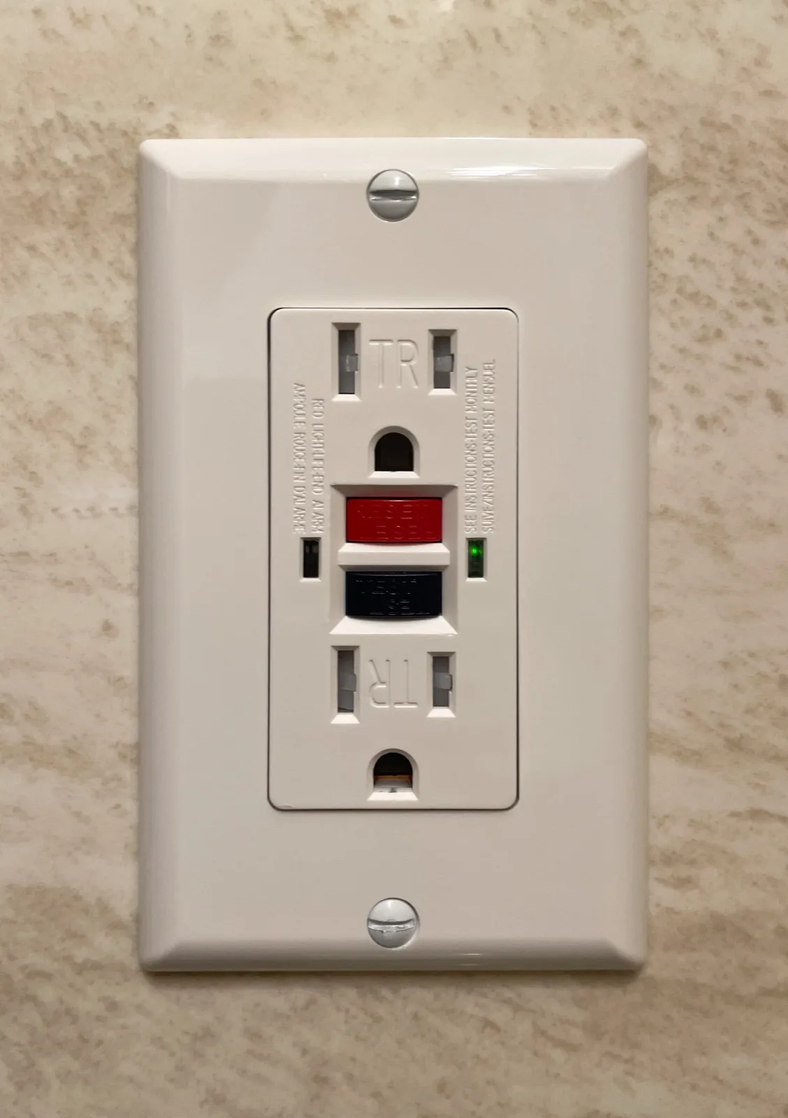GFCI outlet installed on a bathroom wall