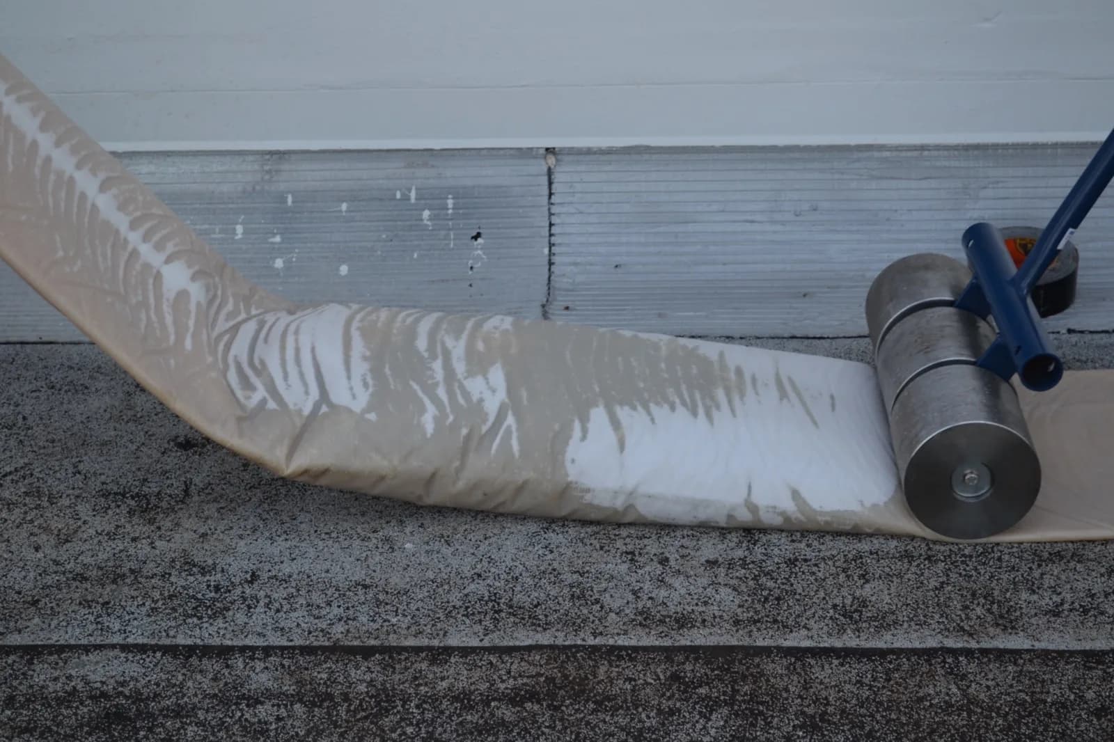 Cured-in-place liner being coated for a trenchless sewer repair