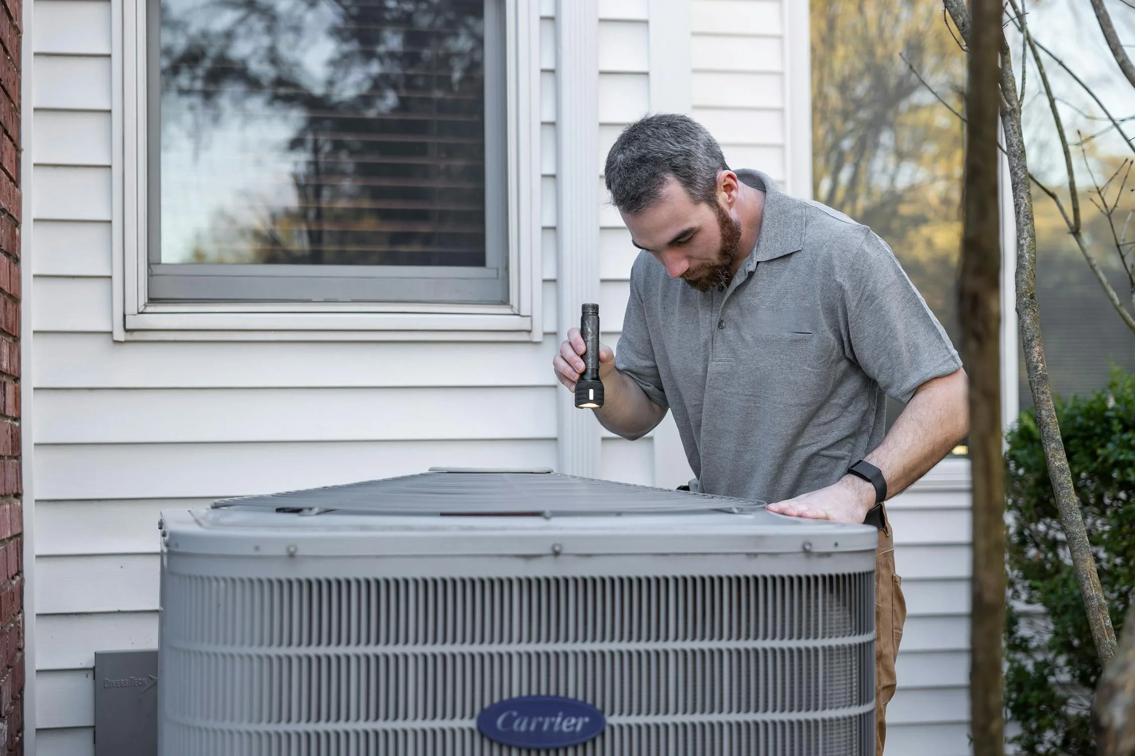 Aces Highlands technicians installing HVAC equipment at a Southern Maine home